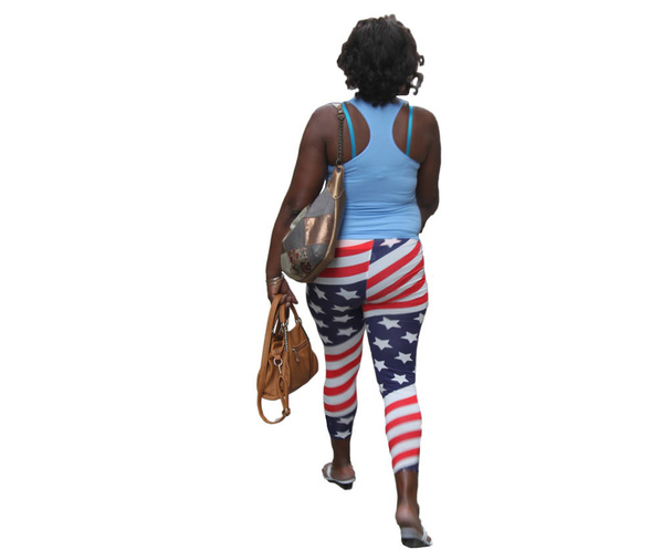 μαύρη γυναίκα βόλτες με αμερικανικό παντελόνι - Φωτογραφία, εικόνα