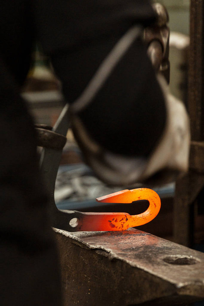 Blacksmith Tapping Hot Metal Hook On Iron Anvil - Photo, Image