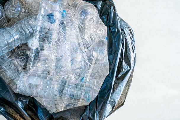Closeup plastic bottles in trash bag, Global warming concept wit - Photo, Image