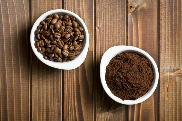 coffee beans and ground coffee in bowls - Foto, Imagen