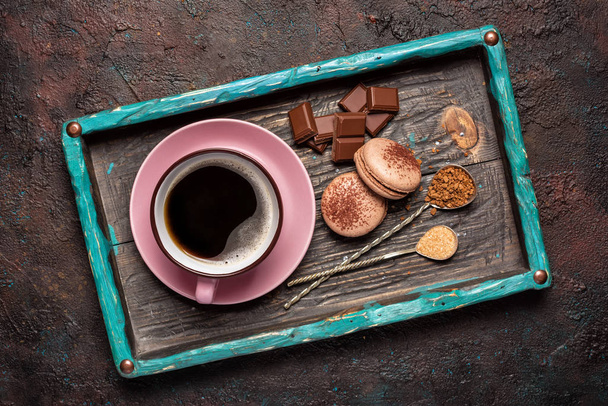 French chocolate macaroons with cup of coffee - Foto, imagen