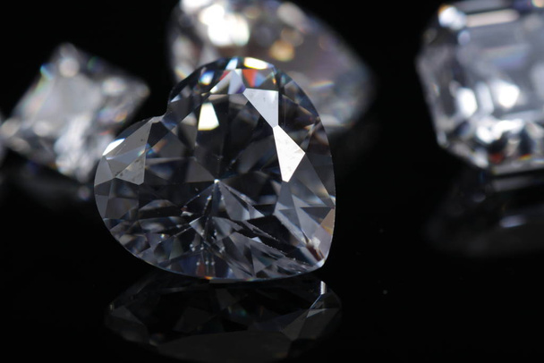 Macro shoot of heart shaped sparkling diamond isolated background - Foto, Bild