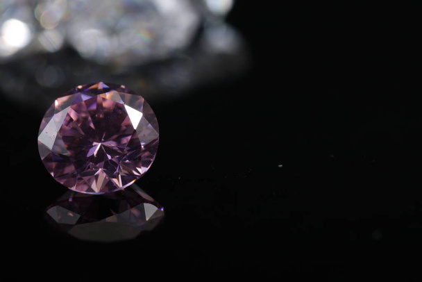 Macro shoots of pink color round shaped shiny diamond isolated - Foto, afbeelding