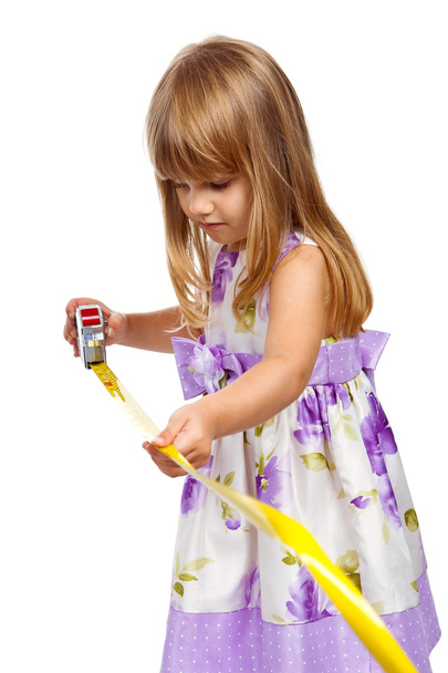 Little girl with measuring tape - Фото, изображение