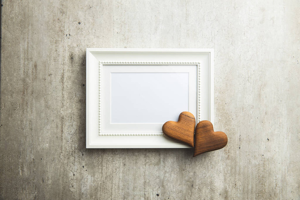 Love Valentine's Day concept. Blank picture frame and heart. - Fotografie, Obrázek