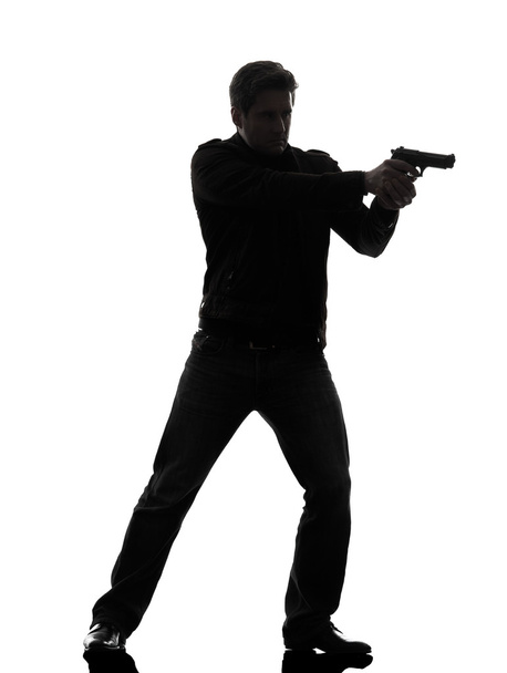 man killer policeman aiming gun standing silhouette - Φωτογραφία, εικόνα