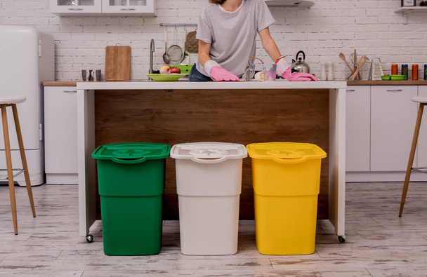Young girl sorting garbage at the kitchen. Concept of recycling. Zero waste - Φωτογραφία, εικόνα