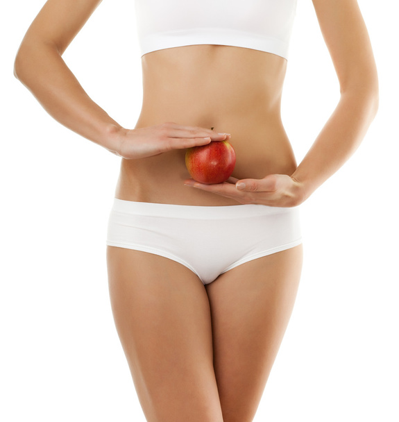 Slim woman with apple - Zdjęcie, obraz