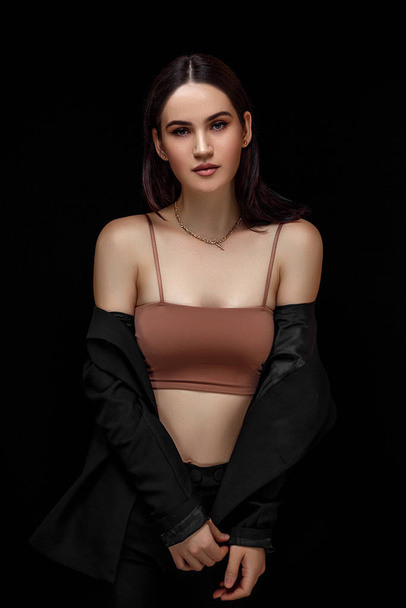High fashion portrait of young elegant woman in black suit and b - Foto, afbeelding