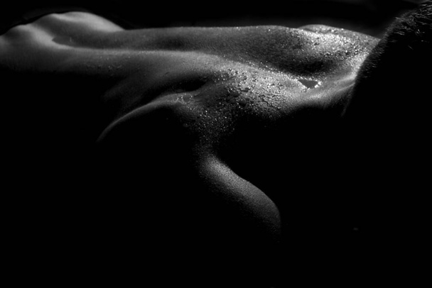 naked woman with wet body on black background - Фото, изображение