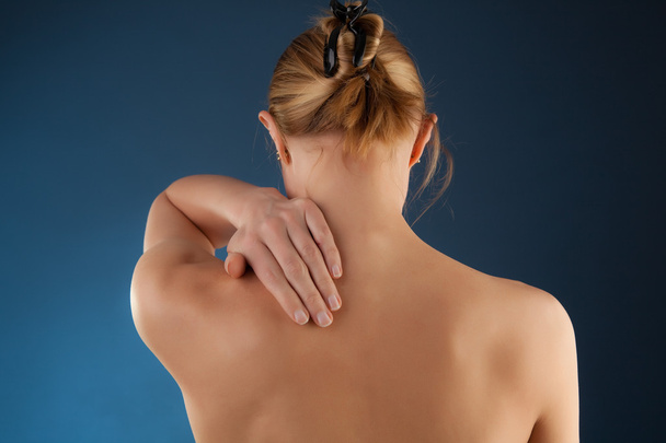 Woman massaging pain back - Fotografie, Obrázek