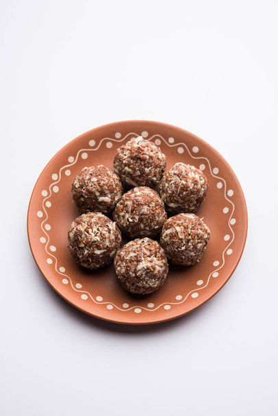 Aliv Laddu, Halim Ladoo or Garden cress Seed sweet Balls a very nutritious food in winters or for New Moms. popular food from India. served in a bowl or plate - Photo, Image