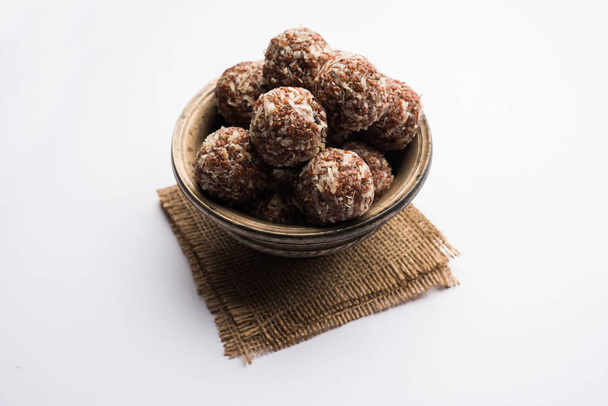 Aliv Laddu, Halim Ladoo or Garden cress Seed sweet Balls a very nutritious food in winters or for New Moms. popular food from India. served in a bowl or plate - Photo, Image
