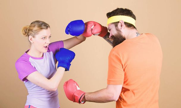 Our warm up is your work out. sportswear. Fight. Happy woman and bearded man workout in gym. knockout and energy. couple training in boxing gloves. training with coach. punching, sport Success - Foto, Bild
