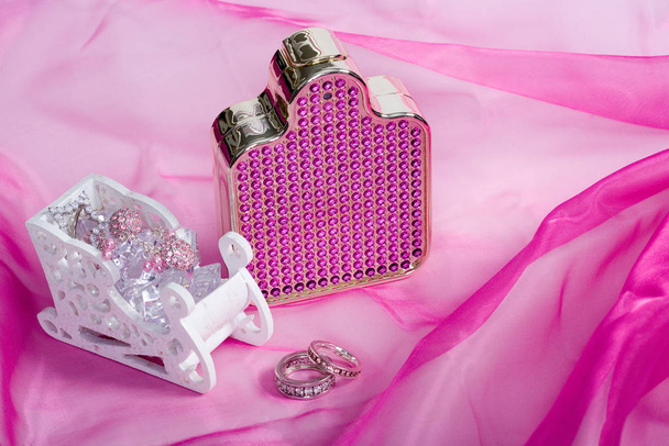 perfume bottle on pink background - 写真・画像