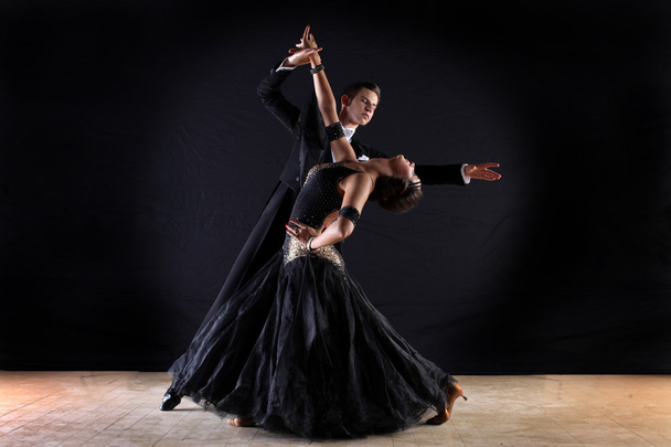 Latino dancers in ballroom isolated on black background - 写真・画像