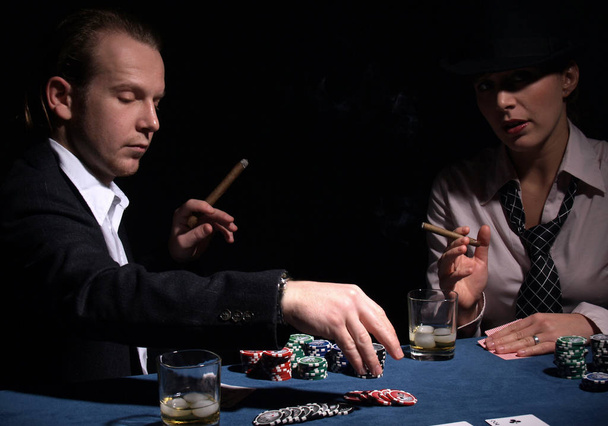 poker player in casino with chips and cards - Foto, imagen