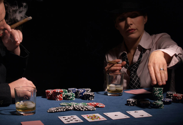 poker player in a casino with a gun - Foto, immagini