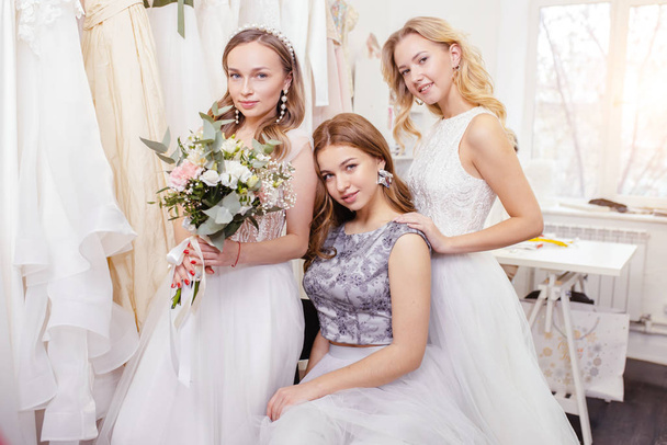 portrait of charming ladies in wedding dresses - Фото, зображення