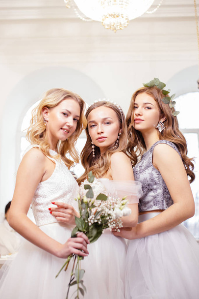 three caucasian brides with beautiful hair and makeup posing in salon - Foto, Imagen