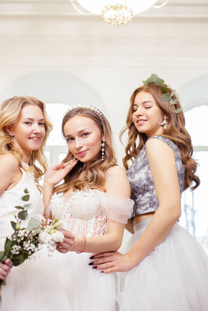 beautiful brides together in wedding salon - Фото, изображение
