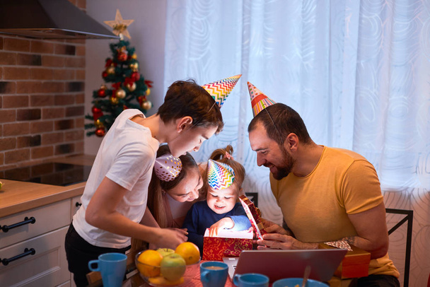 positive family celebrate birthday of little girl in kitchen - Photo, image