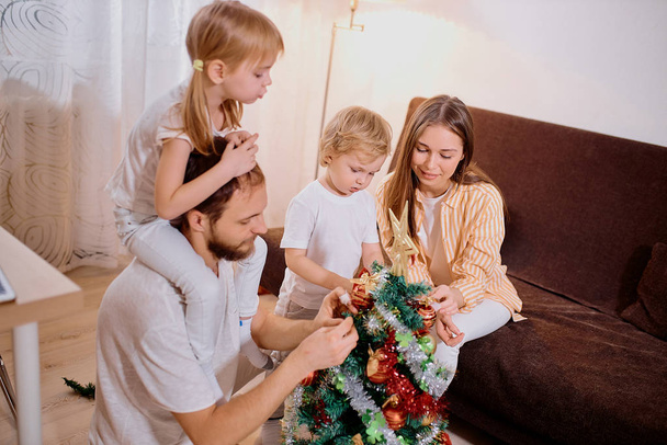 christmas and new year concept, family at home - Фото, изображение