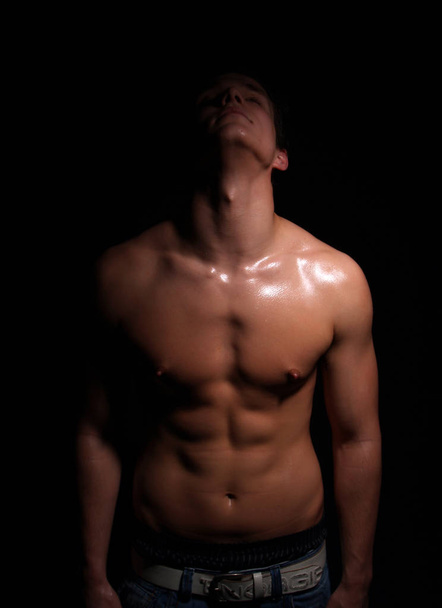 young muscular man with perfect body posing in studio - Φωτογραφία, εικόνα