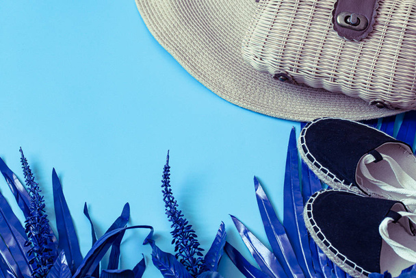 Summer accessories, shoes and hat with bag on blue background. - Foto, Imagem