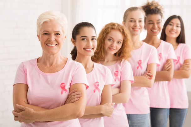 Women In T-Shirts With Awareness Ribbons Standing Over White Background - Photo, Image