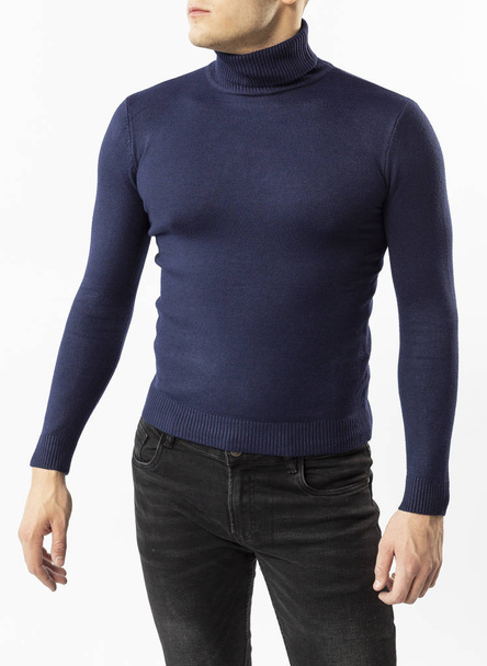 a man in a blue turtleneck and black jeans on a white background, a blue men's turtleneck close-up - Valokuva, kuva