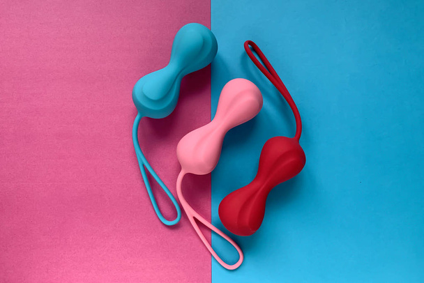 Sex toys. Jiggle balls on a color background.  - Zdjęcie, obraz