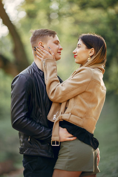 Beautiful couple spend time in a spring park - Photo, Image