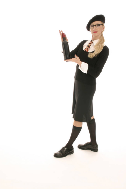 young blond woman holding wine bottle - Фото, изображение