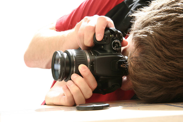 photographer with camera and a dslr equipment - Photo, image