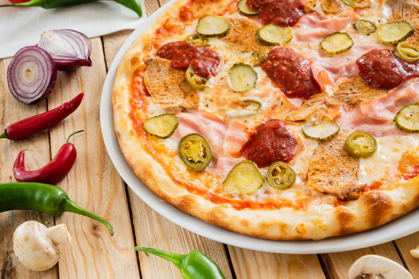 tasty pizza on the wooden background - Foto, immagini