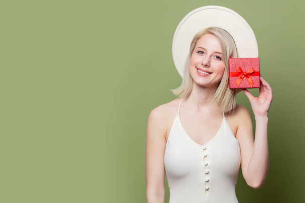 Beautiful blonde woman with red gift box - Photo, Image