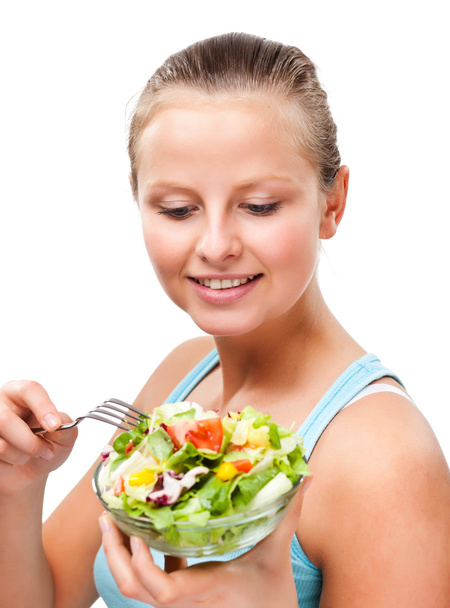 Woman eating vegetable salad - Foto, Imagem