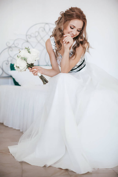 Beautiful young bride in white wedding dress posing   - 写真・画像