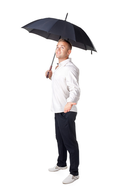 young man under an umbrella - Foto, afbeelding
