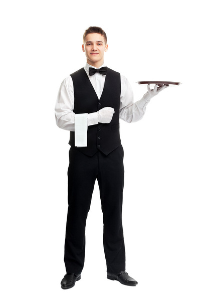 Young smiling waiter with empty tray - Zdjęcie, obraz