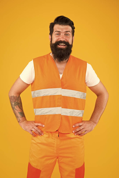 Man of any job. Man worker or workman smiling on yellow background. Happy construction worker or builder. Bearded man in work clothes. Professional man with long beard and mustache - Valokuva, kuva