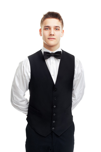 young smiling waiter isolated on white background - Foto, afbeelding