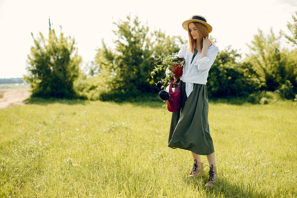 Beautiful woman in a summer field - Zdjęcie, obraz