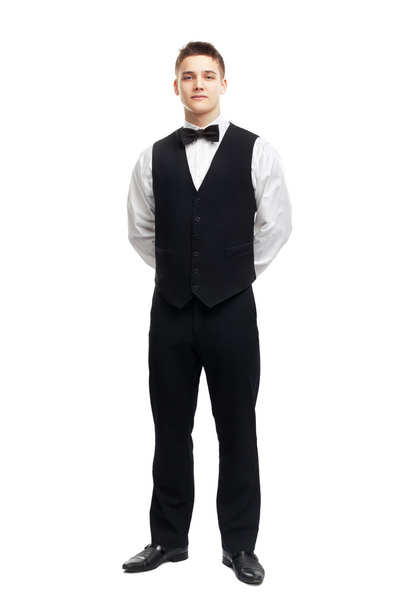 Full length portrait of young smiling waiter - Foto, afbeelding