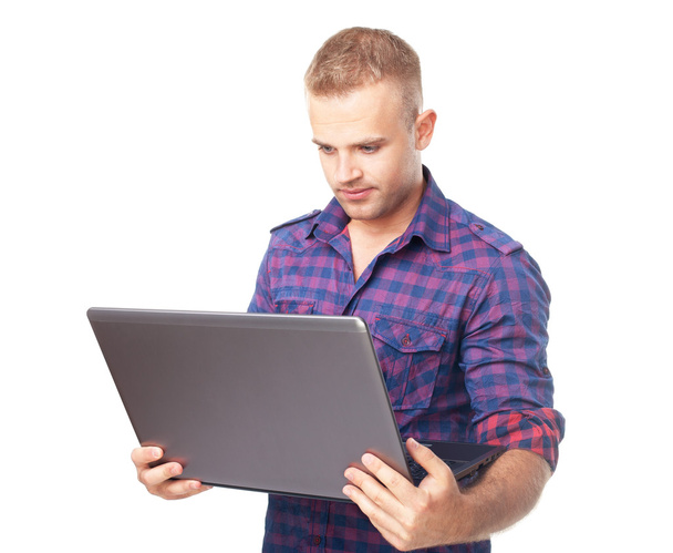 Young man using laptop computer - Foto, Imagen