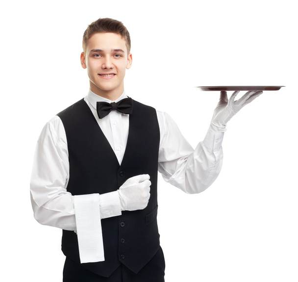 Young smiling waiter with empty tray - Foto, Bild