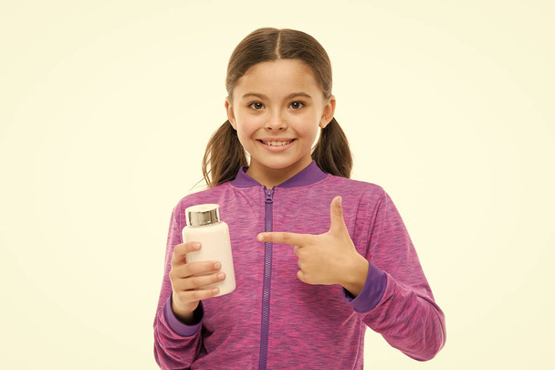 Add vitamin to your ration. food additives complex. healthy sporty kid vitamin jar. Little girl happy smile. small child isolated on white. pills for healthy growth. early phisical development - Φωτογραφία, εικόνα