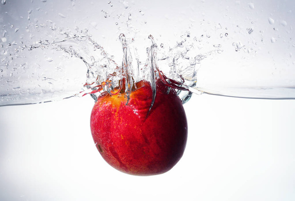 pomegranate fruit in a glass on a white background - Photo, Image