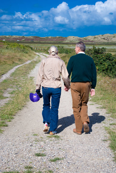 senior couple walking in the mountains - Valokuva, kuva